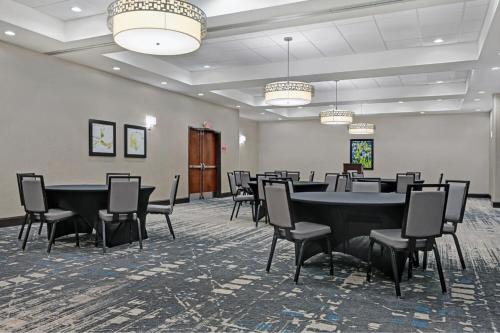 a conference room with a table and chairs at Four Points by Sheraton Birmingham Homewood in Homewood
