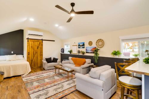 a bedroom with a bed and a living room at Columbia Falls Studio 20 Mi to Glacier Natl Park in Columbia Falls