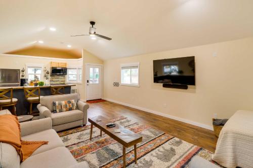 a living room with a couch and a table at 20 Mi to Glacier Natl Park Columbia Falls Studio in Columbia Falls