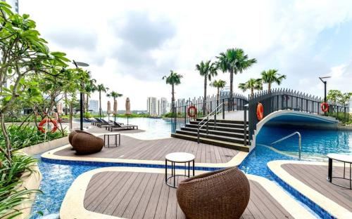 a swimming pool with a slide in a resort at Riviera Point Apartment 5 star in Ho Chi Minh City