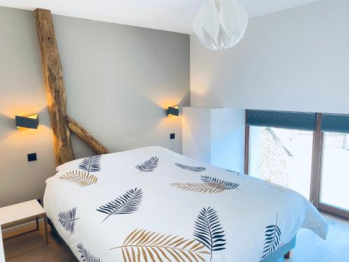 Postel nebo postele na pokoji v ubytování Gîte Origami
