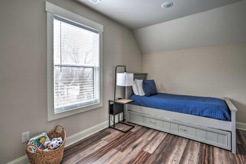 a bedroom with a bed and a window at Wooded Escape with Beautiful Backyard and Mtn Views! in Chattanooga