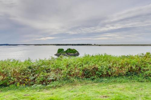 an island in the middle of a large body of water at Rustic Coastal Smith River Cottage with Ocean Views! in Smith River