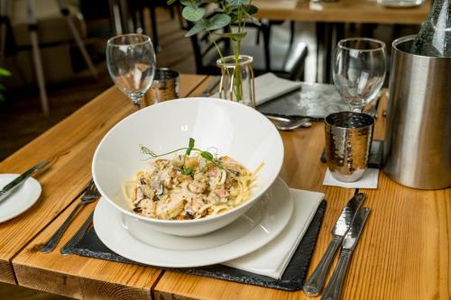 a bowl of food on a wooden table at The Gower Hotel in Swansea