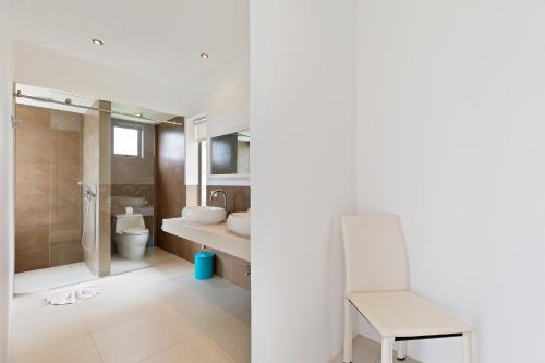 a bathroom with a shower and a toilet and a sink at Villa Pearl - Amazing View in Amphoe Koh Samui