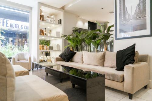 a living room with a couch and a table at Principado Downtown in Buenos Aires