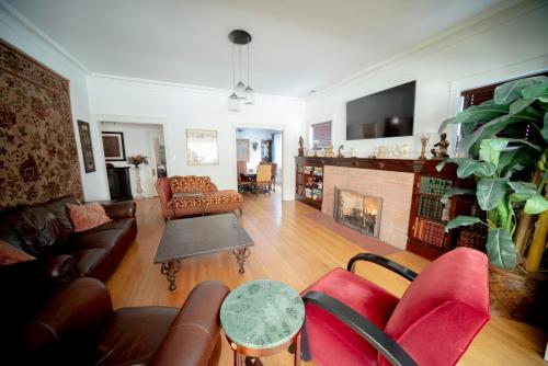 a living room with a couch and a fireplace at Bootlegger House Sleeps 10-20 Free TV & Parking in Chicago