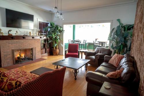 a living room with a couch and a fireplace at Bootlegger House Sleeps 10-20 Free TV & Parking in Chicago