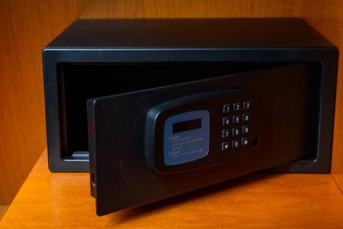 a black microwave oven sitting on top of a table at Killarney Dromhall Hotel in Killarney