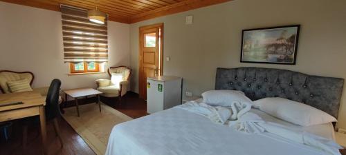 Postel nebo postele na pokoji v ubytování Doğa Park İstasyon Hotel