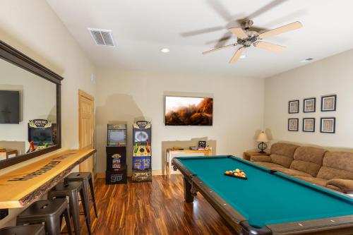 a living room with a pool table and a couch at Hibernation Station - MTN Views near Asheville! in Swiss