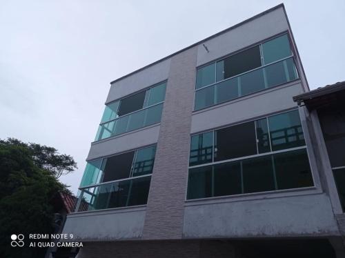 an empty office building with a lot of windows at Pousada Rota do Sol Bombinhas suítes com café e sem limpeza diaria in Bombinhas