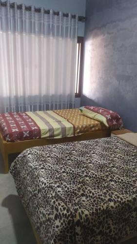 A bed or beds in a room at Barbara House San Ignacio