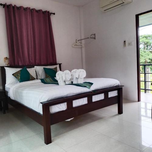 Katil atau katil-katil dalam bilik di Palm Tian Homes A2