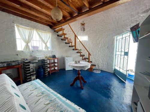 a room with a table in the middle of a room at Huanchaco Domes in Huanchaco