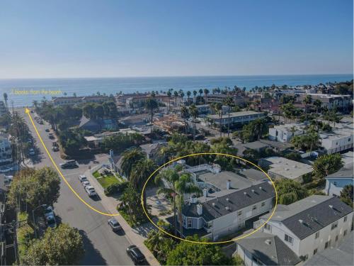 an aerial view of a city with a yellow circle at Pelican Cove Inn in Carlsbad