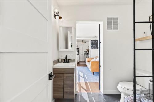 a bathroom with a sink and a toilet at The River Box - Luxury Container Home - views and Hot Tub in Yakima