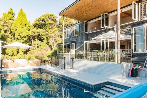 an image of a house with a swimming pool at Private Luxury in Paihia - with Heated Pool! in Paihia