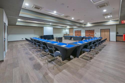 a large conference room with a long table and chairs at City Express Plus by Marriott Ciudad de México Mundo E in Mexico City