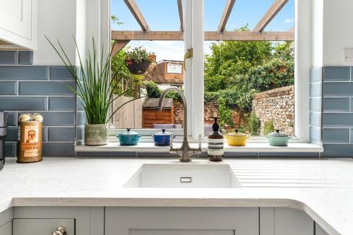 a kitchen with a sink and a window at Cottage, Central Saffron Walden, Garden, Little Braybrooke in Saffron Walden