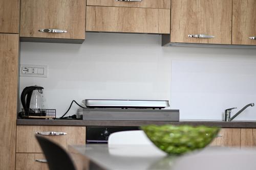 a kitchen with a table with a bowl on it at Borgo Caridà - Green Family Holidays in Zaccanopoli