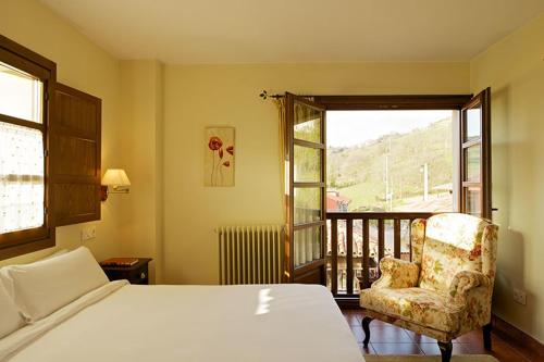 Posteľ alebo postele v izbe v ubytovaní Hotel Rural Casa de la Veiga