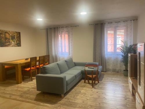 a living room with a couch and a table at Apartment am Schlosspark 3 in Cheb