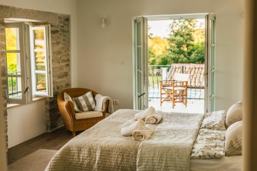 a bedroom with a bed with towels on it at Villa Kanedolo in Momjan