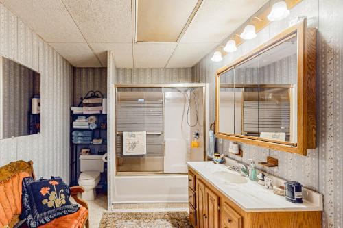 a bathroom with a tub and a sink and a shower at Red Barn Retreat 