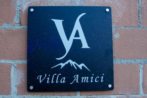 a sign on a brick wall with the initials vailla amir at [vista Sibillini] Villa Amici in Verri