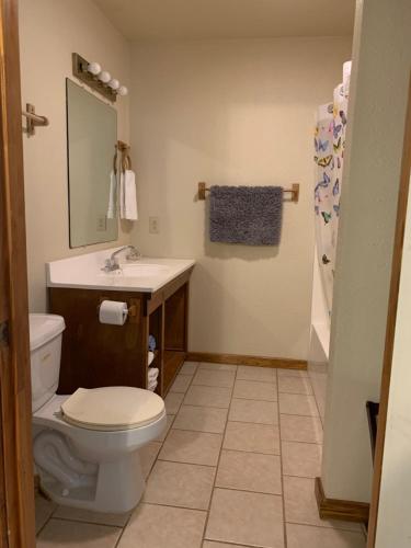 a bathroom with a toilet and a sink at Holly Park Marina in Milam