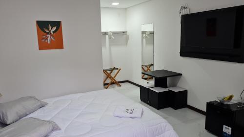 En eller flere senge i et værelse på Estalagem Floradas da Serra