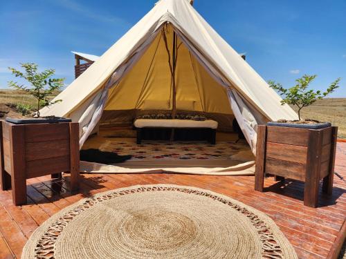 a tent in the middle of the desert at Two Little Piggies Glamping 