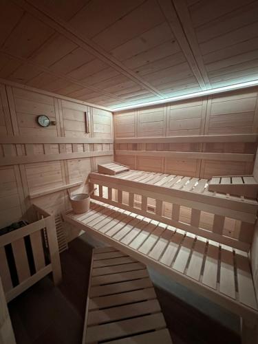 an empty sauna with two beds in it at Five Apartments in Inđija