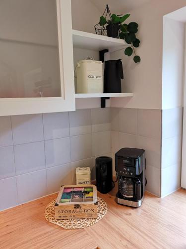 a box sitting on a counter in a kitchen at Ferienbauernhof Ennenhof in Schneverdingen