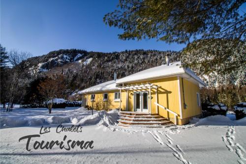 Les Chalets Tourisma - Chalet au bord de l'eau avec spa et foyer - Le Draveur
