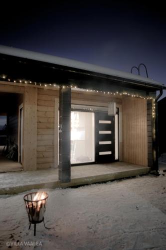 a store front at night with lights on it at Villa Vaalea in Rovaniemi