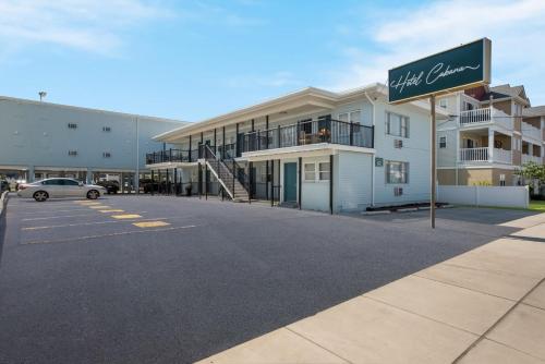 a parking lot with a sign in front of a building at Hotel Cabana Oceanfront/Boardwalk in Wildwood