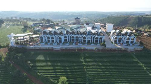 an aerial view of a building in a field at LAKE HILL Villas in Bao Loc