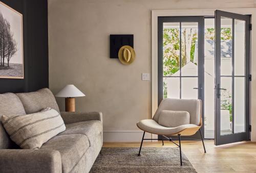 a living room with a couch and a chair at 9 Academy in Salisbury