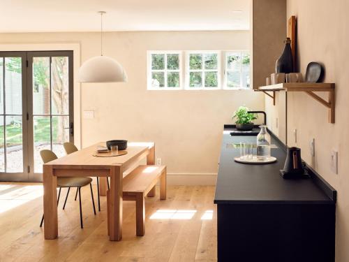 a kitchen with a table and a dining room at 9 Academy in Salisbury