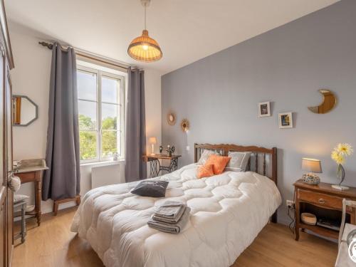 a bedroom with a large white bed and a window at Gîte Nourard-le-Franc, 5 pièces, 6 personnes - FR-1-526-44 in Ravenel