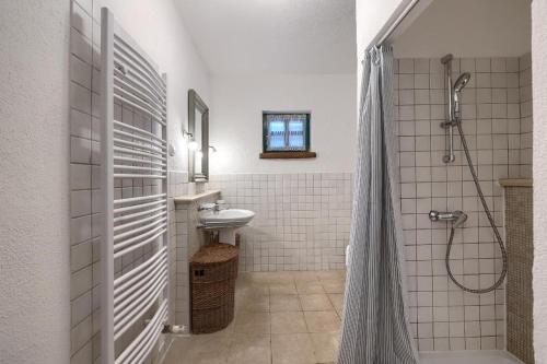 a white bathroom with a sink and a shower at Villa Leopoldo by Istrian Country Houses in Barat