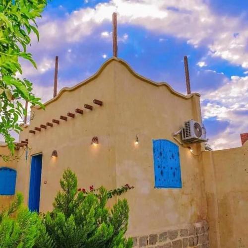 a building with a fan on the side of it at Khan tunis villa in Tunis