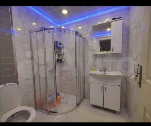 a bathroom with a shower and a toilet and a sink at Sokak in Alanya