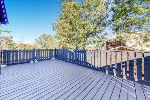 a wooden deck with a fence on a house at Stunning 7 Br RougeView Home with 2 Kitchens, 5 Bathrooms, Amazing Backyard & 8-Car Parking in Toronto