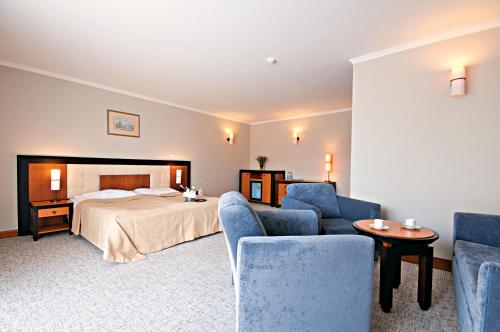 Postel nebo postele na pokoji v ubytování Łeba Hotel & Spa