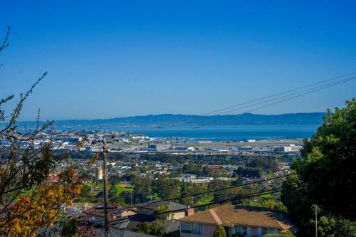 a view of a city with the water in the background at Relaxing Home With SF Bay View in Millbrae