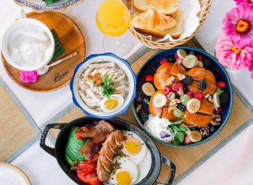 a table with three plates of breakfast food on it at Bann at Oak Knoll Napa in Napa