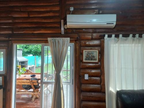 a living room with a air conditioner on the ceiling at EZEIZA quinta cedro azul 10 min del aeropuerto in Ezeiza